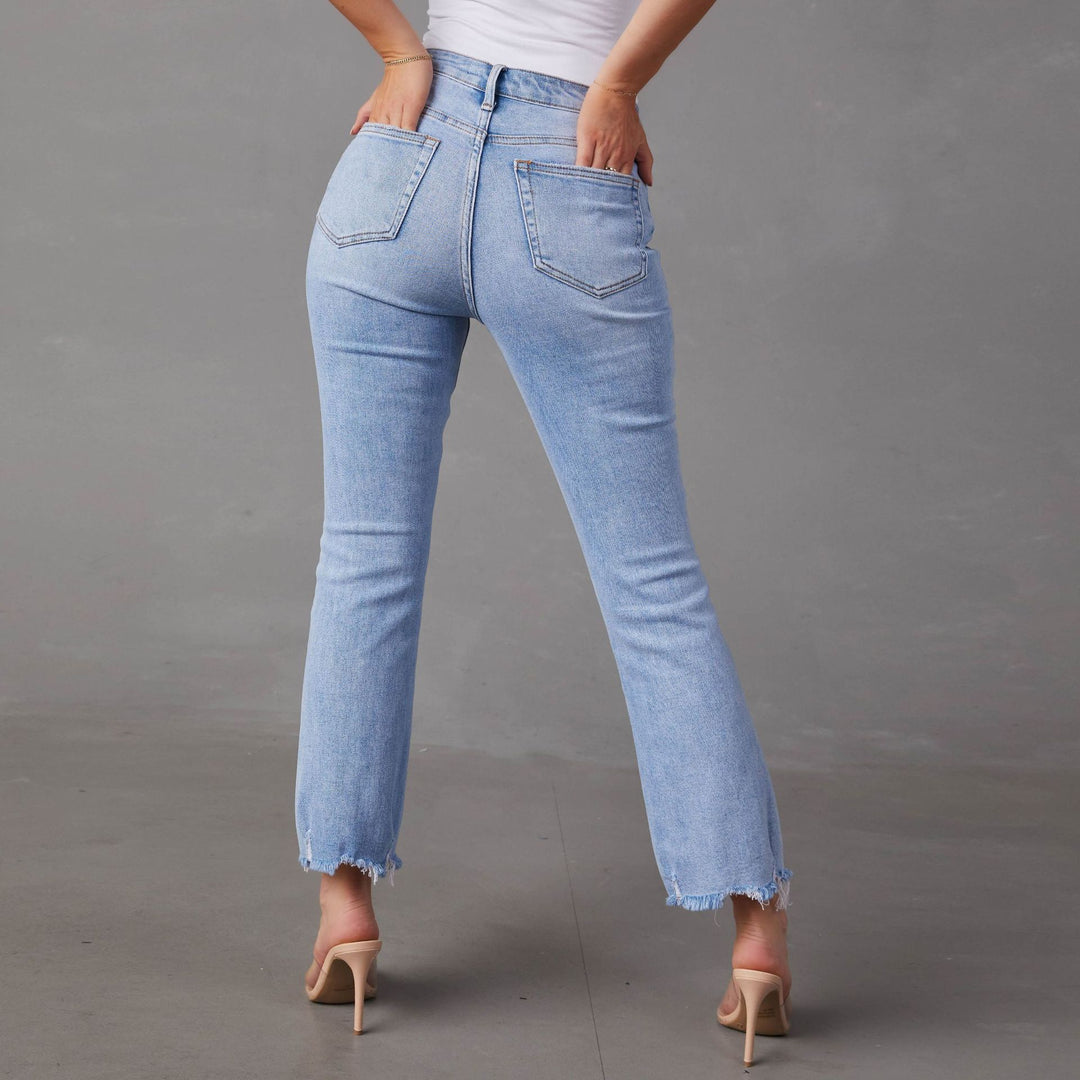 Dame Bootcut Jeans med frynset kanter og modepræget karakter Stilla