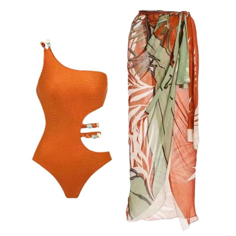 Dame one-piece badedragt med smart cut-out og elegant overkjole Stilla