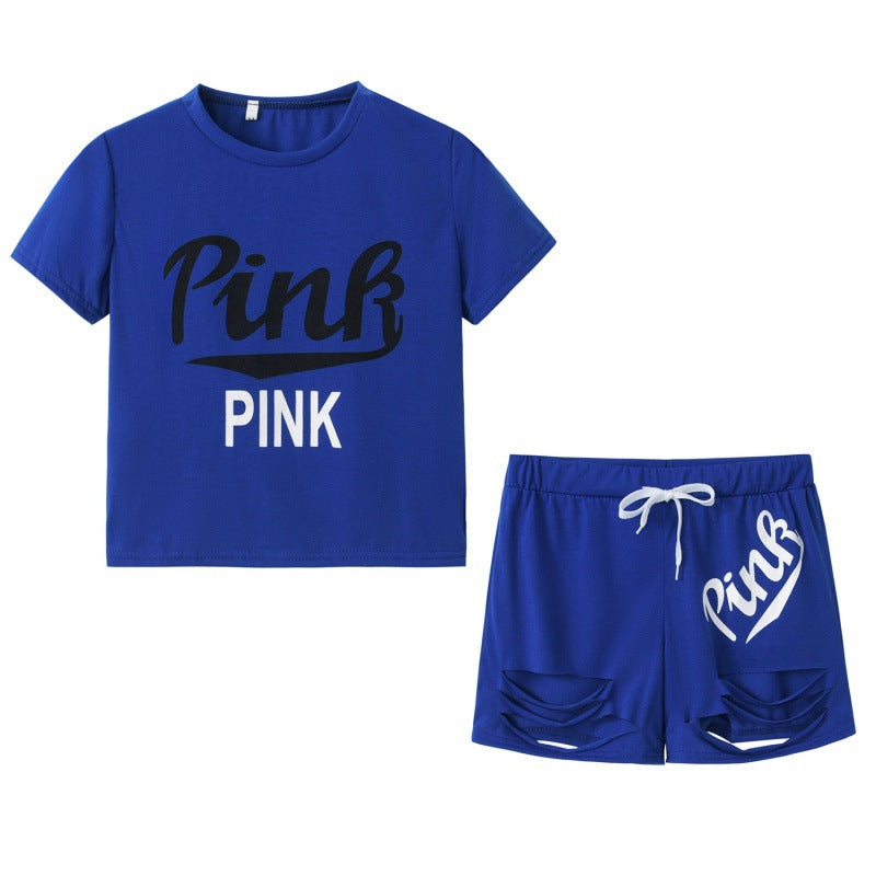 Damer sporty t-shirt og shorts sæt med løs pasform og kontrastprint Stilla