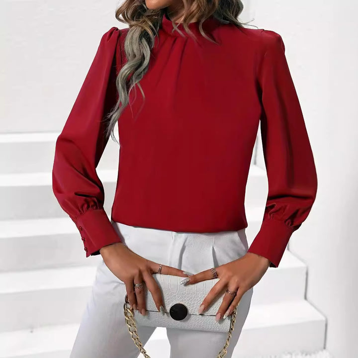 Damebluse med høj krave og elegante puffærmer Stilla