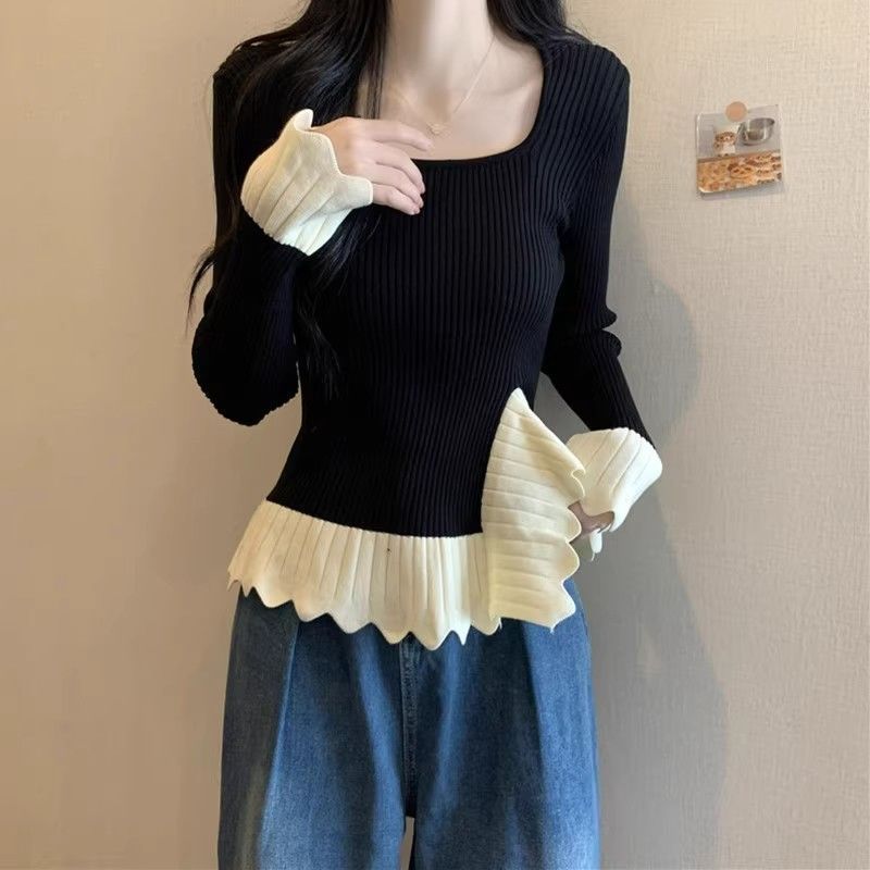 Kvinders fashionable ribstrikkede sweater med asymmetrisk kant Stilla