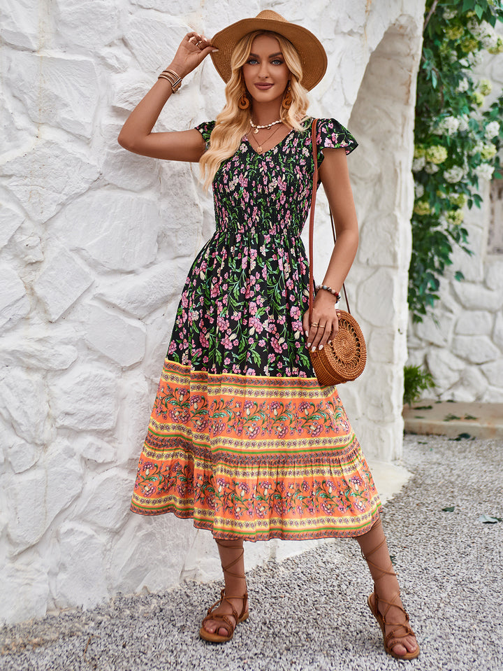 Dame midikjole i bohemian stil med patchwork-mønster og flydende skørt Stilla