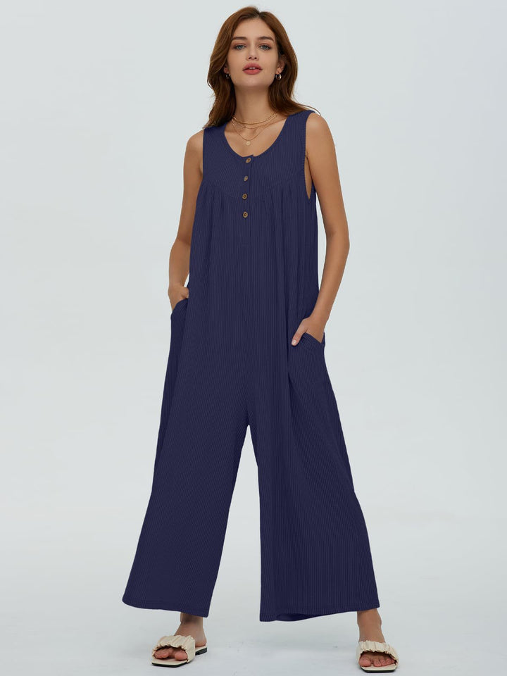 Dame afslappet jumpsuit med vidde ben og knapdetaljer Stilla