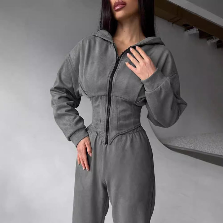 Dame moderat jumpsuit med tætsiddende design og innovativ lynlås Stilla