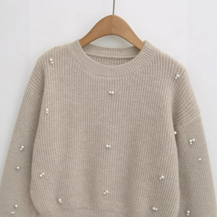 Dame modisk strikpullover med elegante perledetaljer Stilla