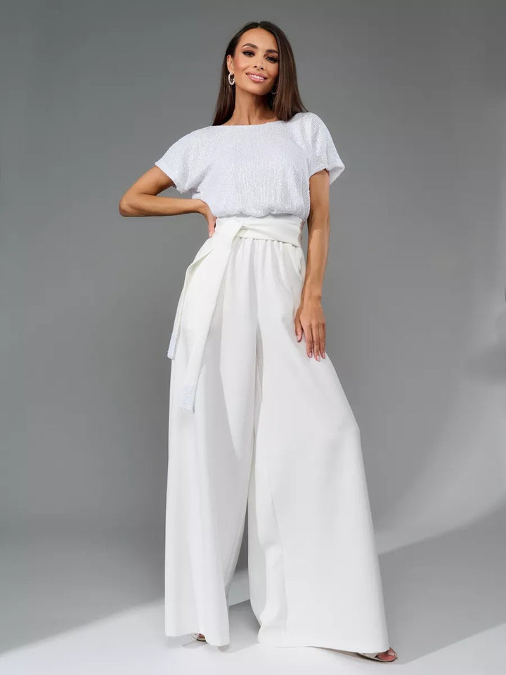 Dame Glitrende Jumpsuit med bredt ben og taljebælte Stilla