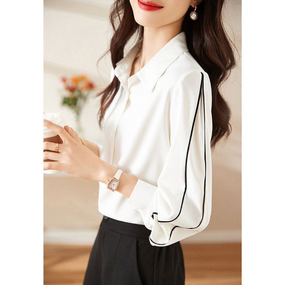 Damernes elegante bluse med klassiske knapdetaljer Stilla