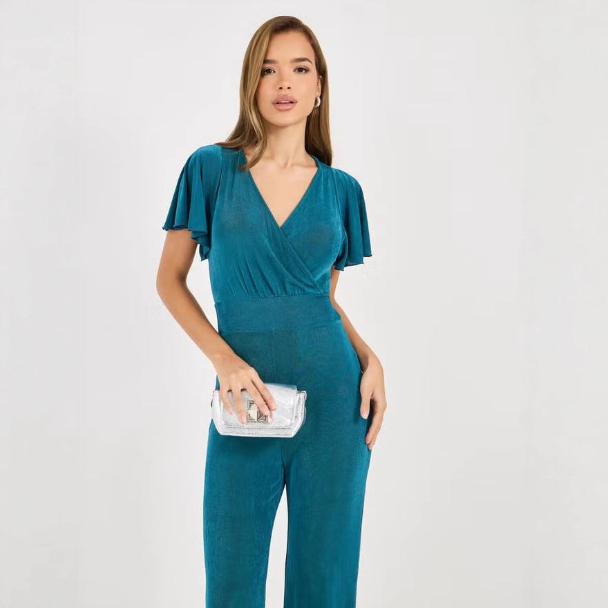 Dame elegant jumpsuit med flydende snit og detaljerede puffærmer Skovae