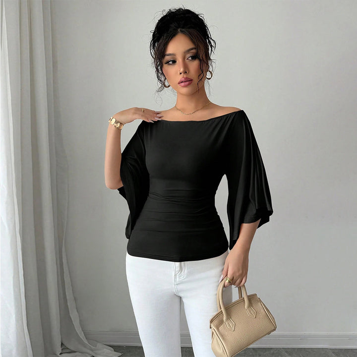 Kvinders elegante off-shoulder top med brede ærmer og tætsiddende pasform Stilla