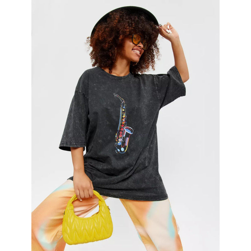 Dame afslappet T-shirt med kreativ saxofonmotiv Stilla