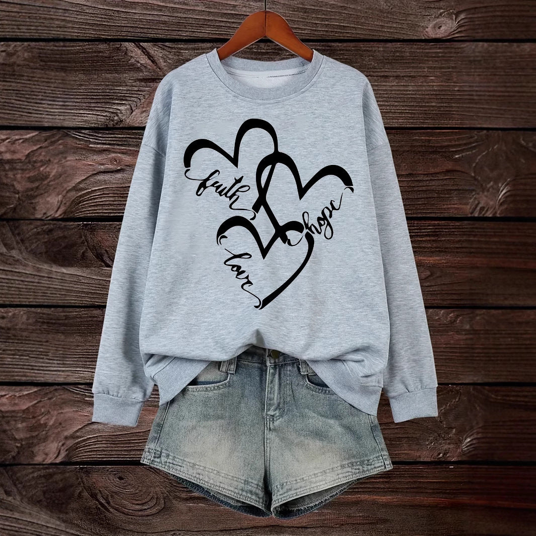 Kvindernes sweatshirt med romantisk hjertemotiv og inspirerende print Stilla
