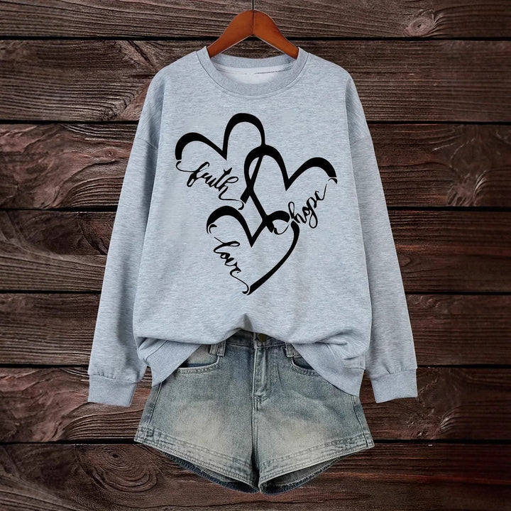 Kvindernes sweatshirt med romantisk hjertemotiv og inspirerende print Stilla