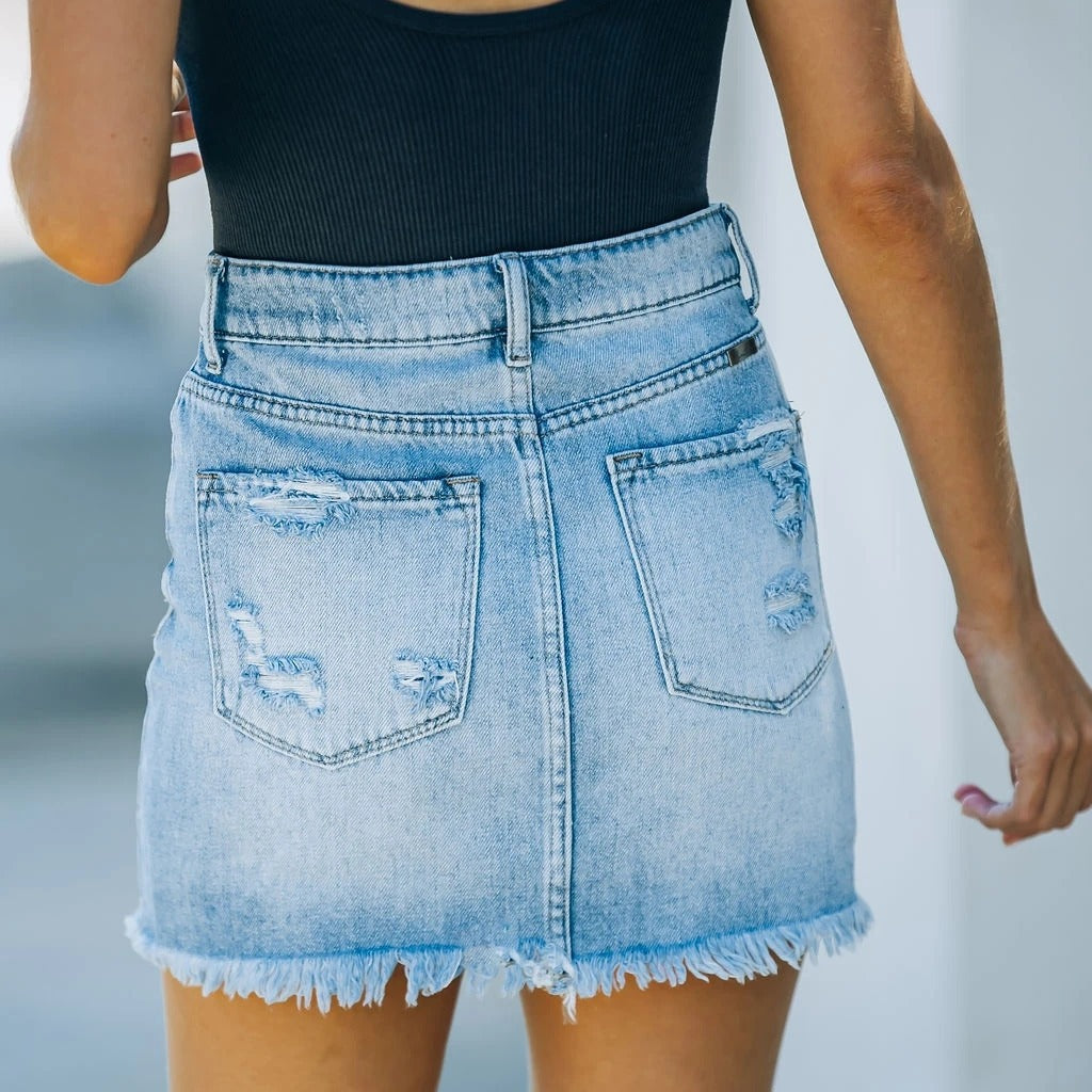 Dame Ribstrik-Bodysuit med revet denim-minip Skørt Stilla