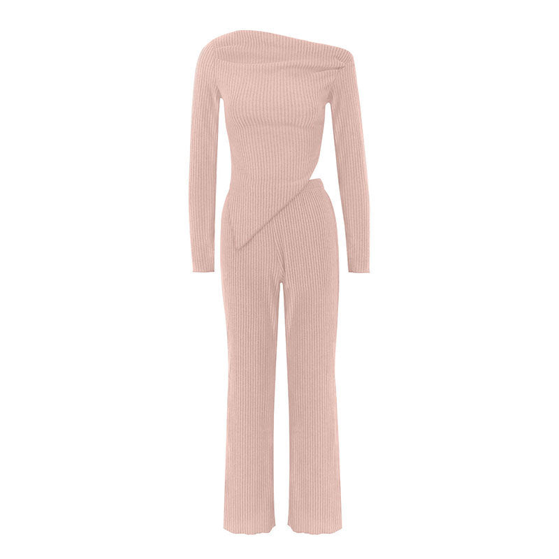 Dame tætsiddende jumpsuit med asymmetrisk udskæring og lange ærmer Skovae