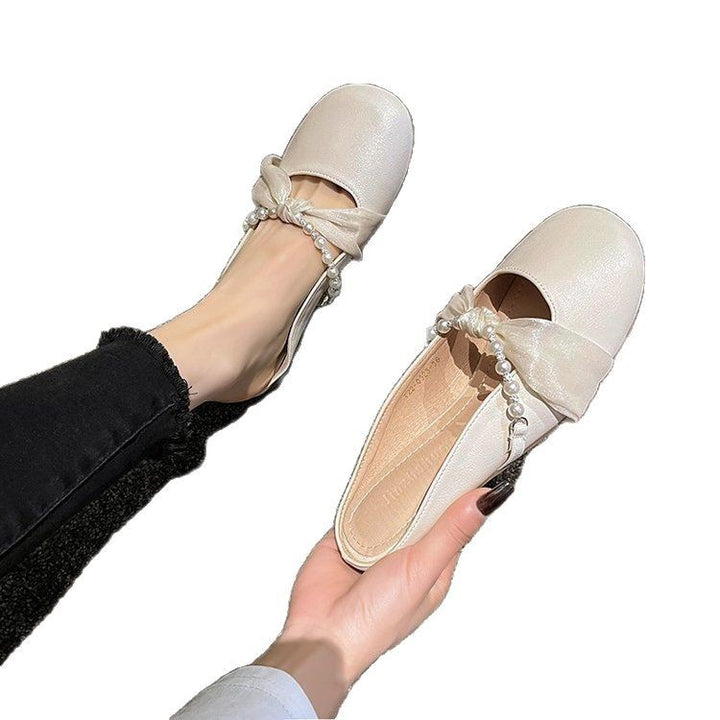 Dames elegante mokkasiner med romantisk sløjfedetalje og perleprydet rem Stilla