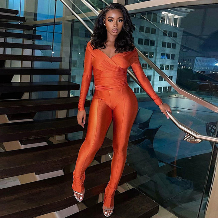 Dame Langærmet Jumpsuit med figursyet design og elegant indpakningsudskæring Stilla