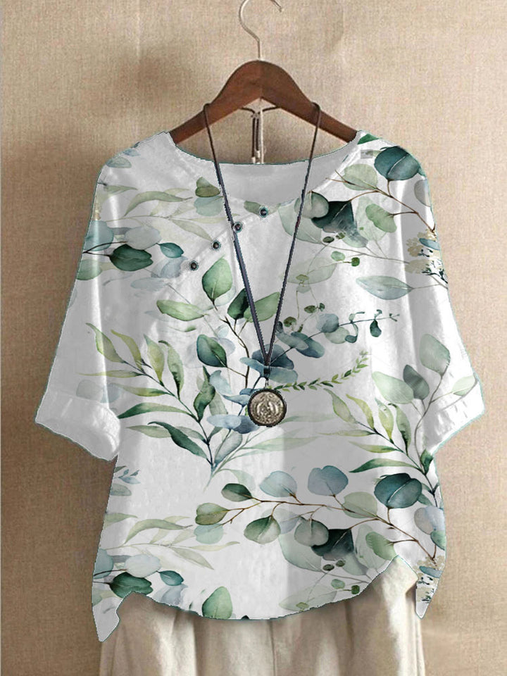 Damer bomuldsbluse med blomstertryk og elegant knaplukning Stilla