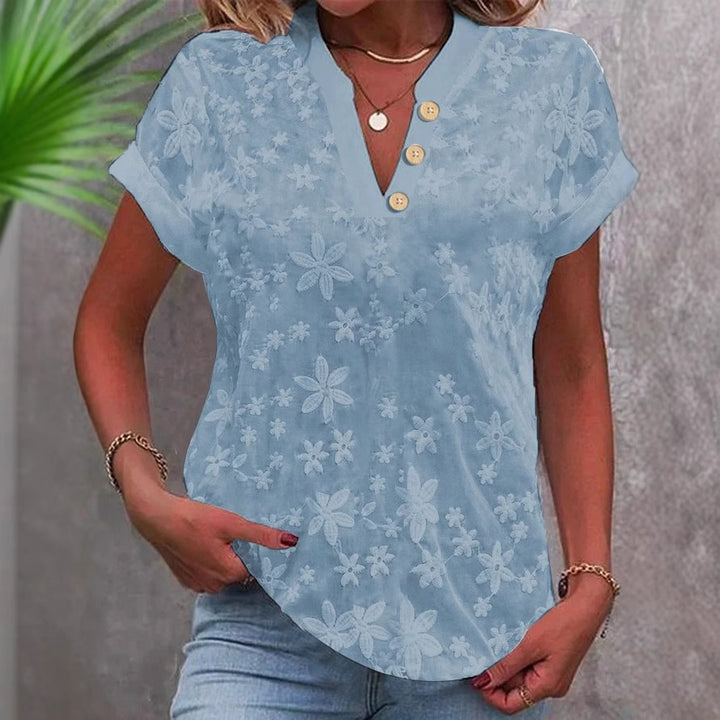 Damer elegant bluse med blomsterdesign og knapdetaljer Stilla