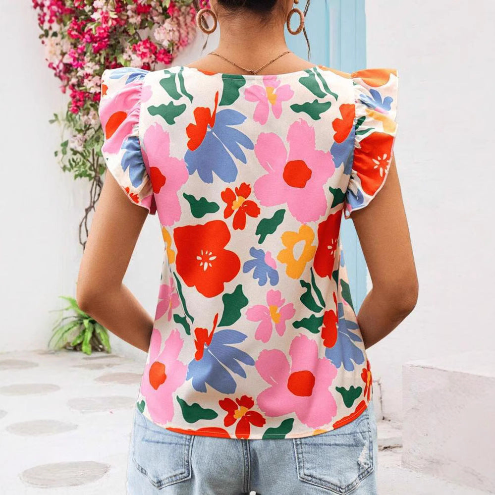 Damebluse med flæsekanter og blomstermotiver Stilla