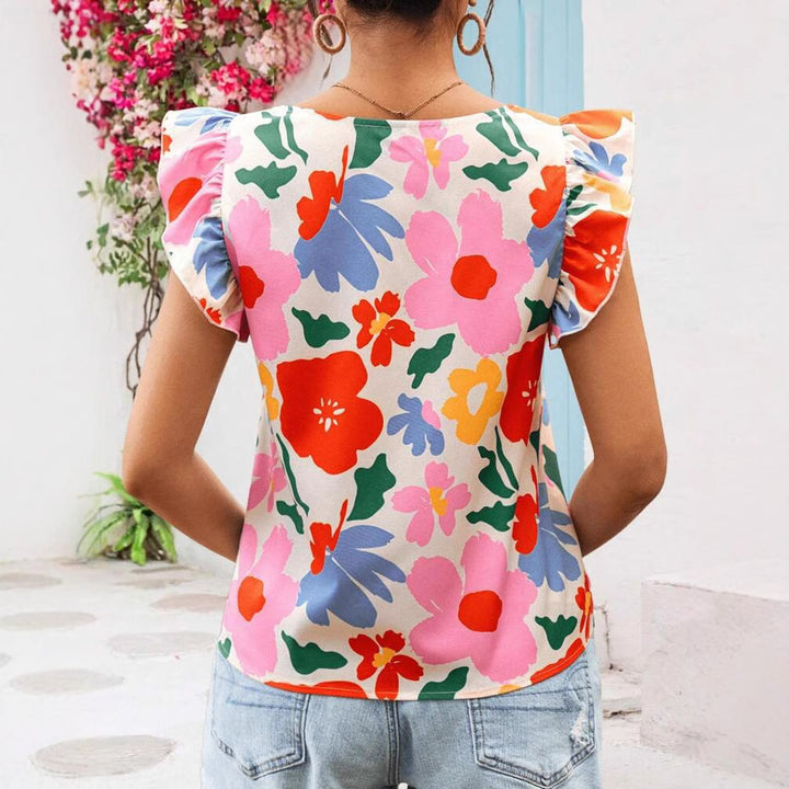 Damebluse med flæsekanter og blomstermotiver Stilla