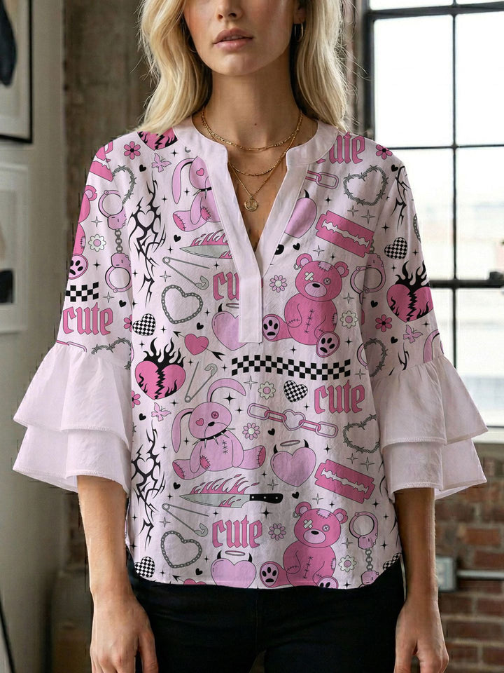 Dame bluse med voluminøse ærmer og kreativt trykdesign Skovae