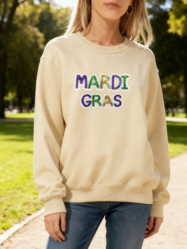 Women's sweatshirt with vibrant Mardi Gras lettering Stilla