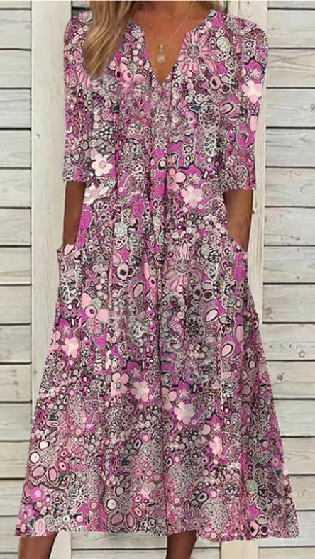 Dame maxikjole med florale accenter og praktiske lommer Stilla