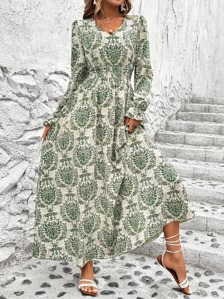Dame Maxikjole med floralt design og vidde skørt Stilla