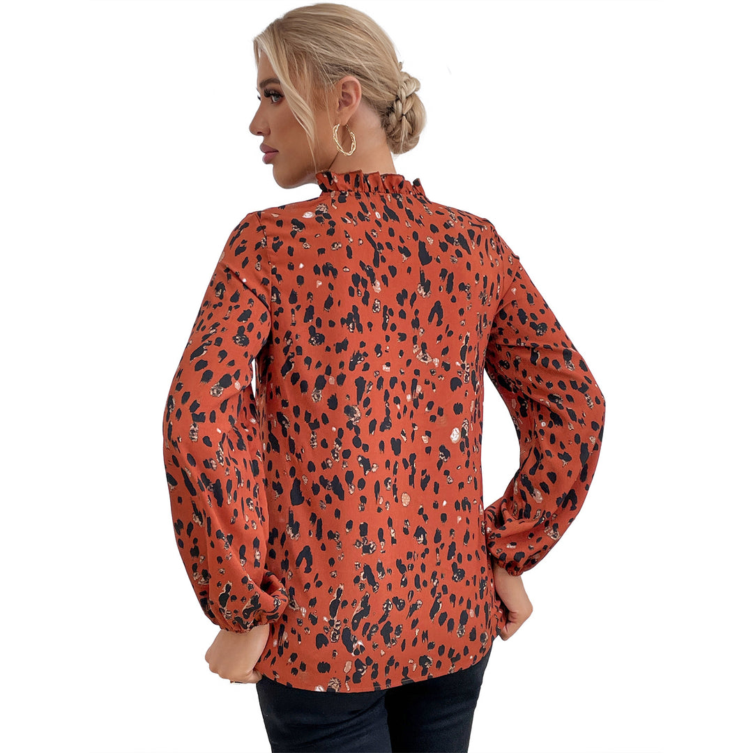 Kvinders bluse med blomsterlig leopardmønster og voluminøse ærmer Stilla