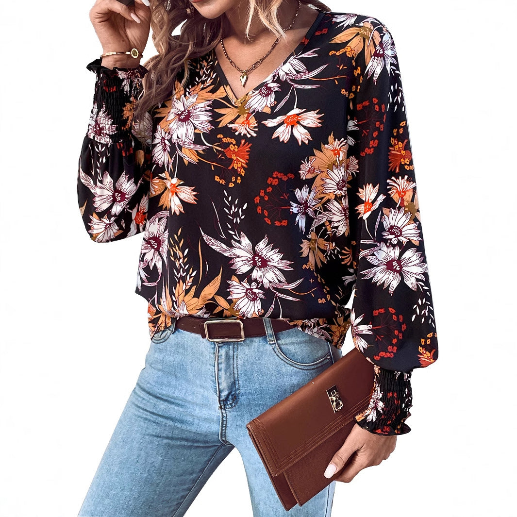 Kvindebluse med blomsterprint og elastiske flæsedetaljer Stilla