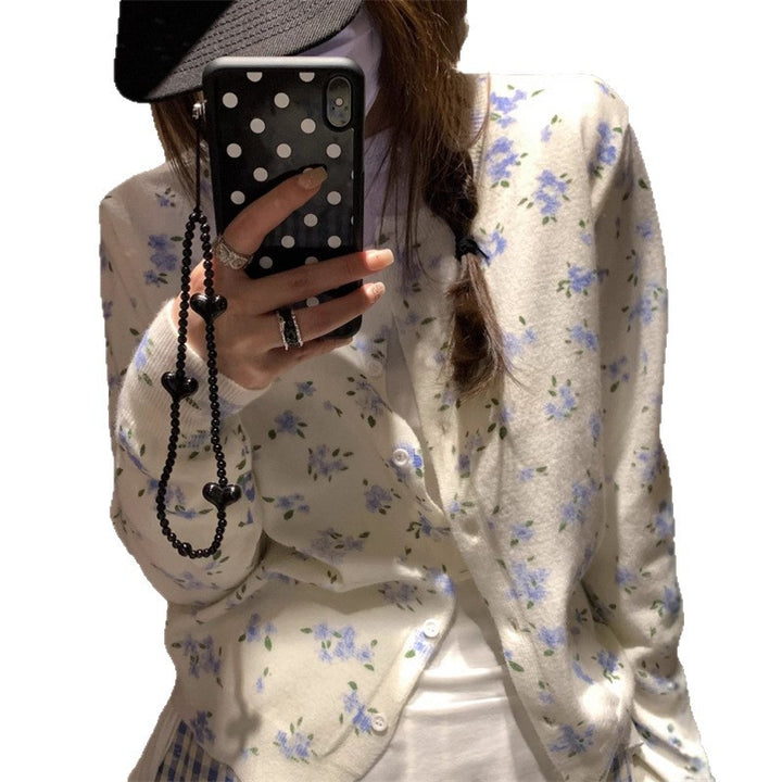 Kvinders cardigan med blomsterdesign og klassisk knaplukning Stilla