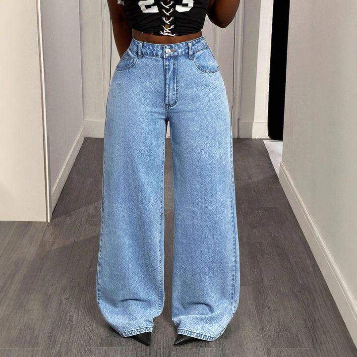 Damernes højtaljede wide-leg jeans med statement print Stilla