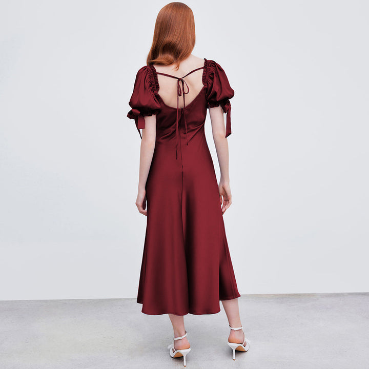 Dame midi kjole med elegante pufærmer og chic V-hals Stilla