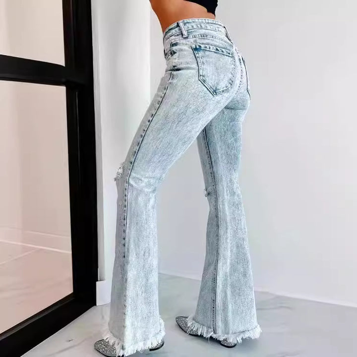 Dame flared jeans med frynset kant og moderne used-look Stilla