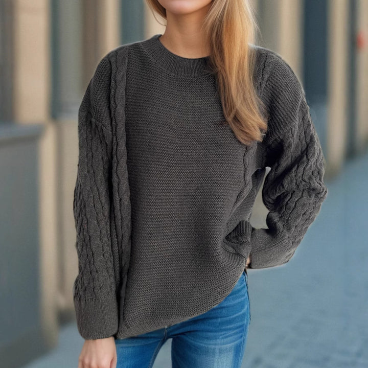 Kvinders chunky striktrøje med kabeldesign og voluminøse ærmer Stilla