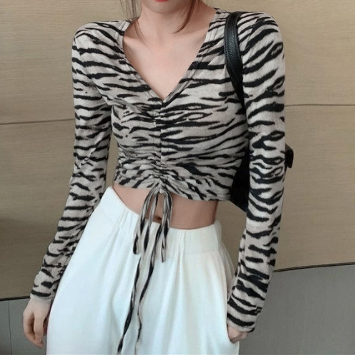 Kvindernes figur-fremhævende crop top med smalle lange ærmer Stilla
