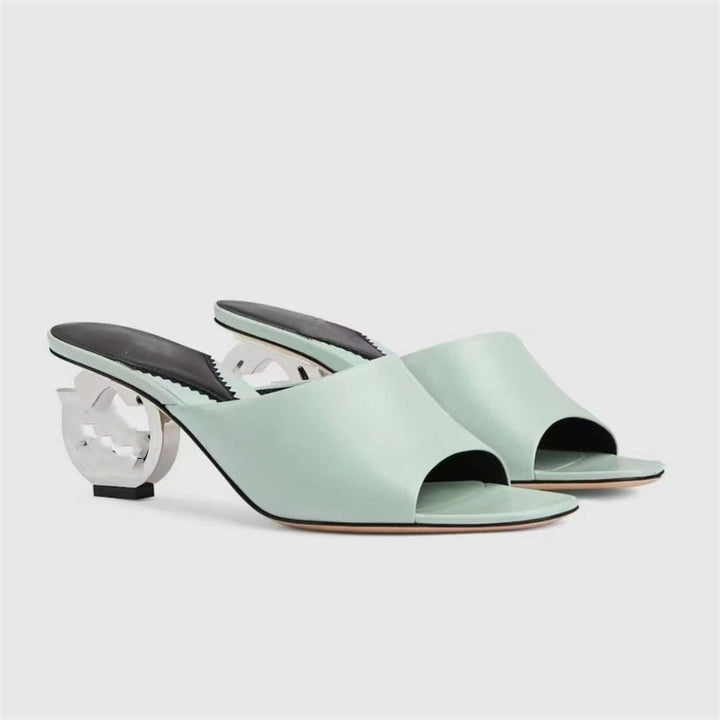 Femme Open-Toe Mules med skulpturel hældesign Stilla