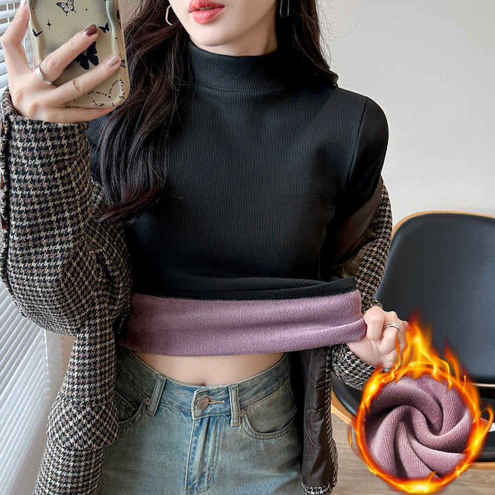 Kvinders langærmet cropped top med høj krave og ribbet tekstur Stilla