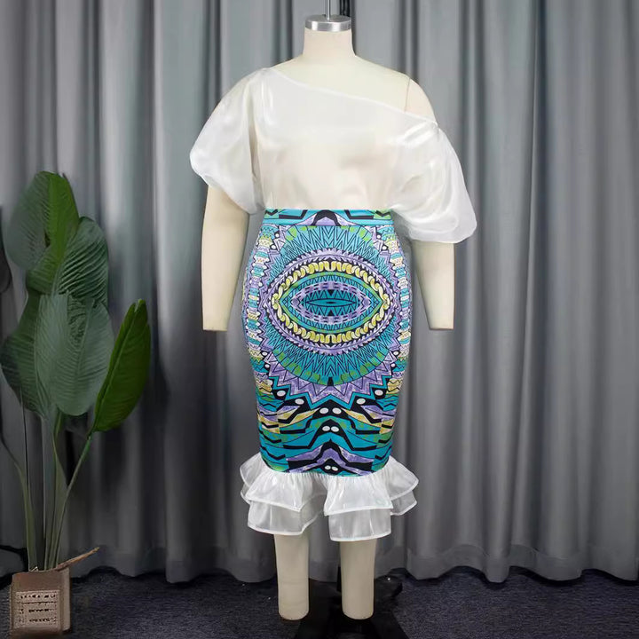 Damer Elegant kjole med asymmetrisk design og farverig print Skovae
