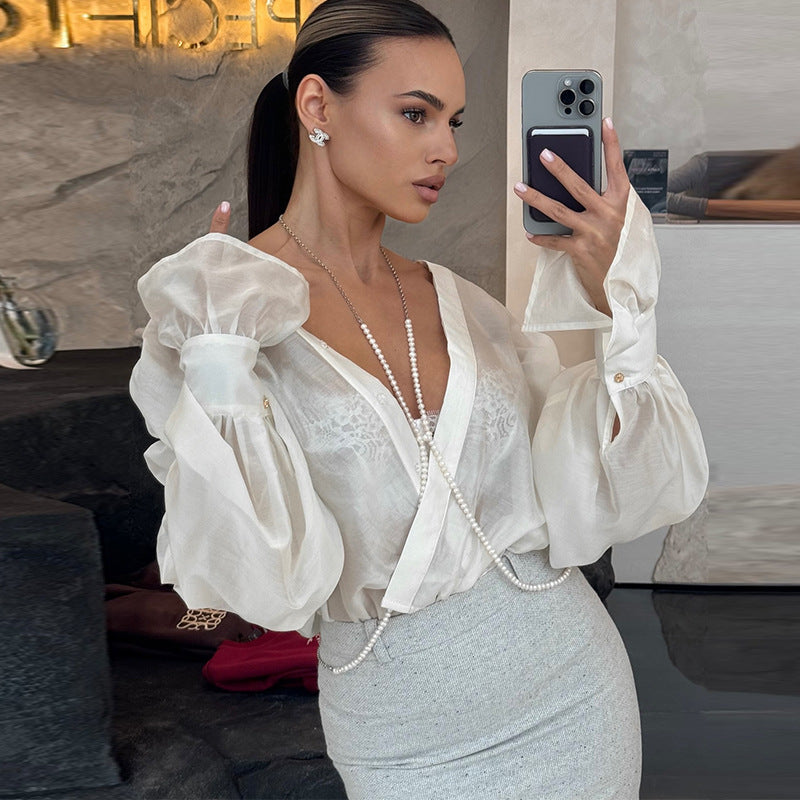 Damebluse med voluminøse ærmer og elegant snit Stilla