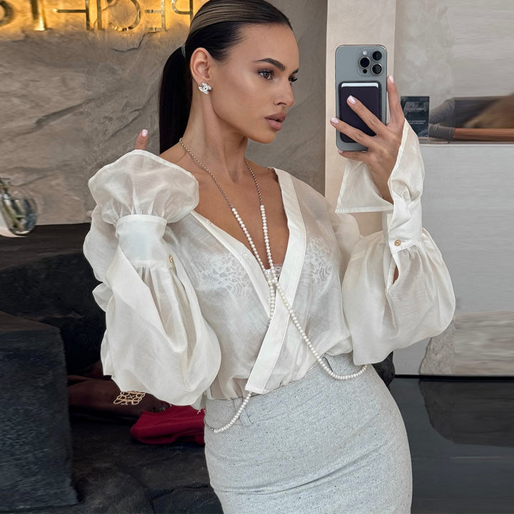 Damebluse med voluminøse ærmer og elegant snit Stilla