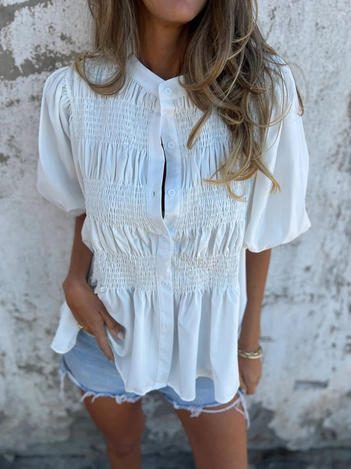 Damebluse med smart smock-design og knaplukning Stilla