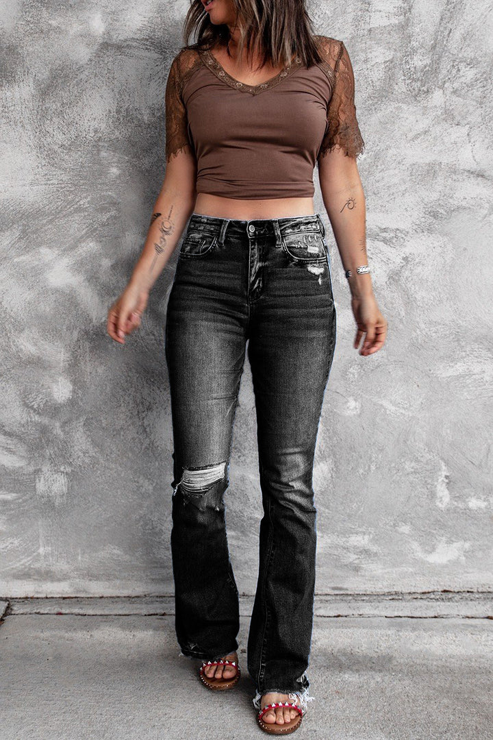 Dame brede flared jeans med moderigtige destroyed-look og høj talje Stilla