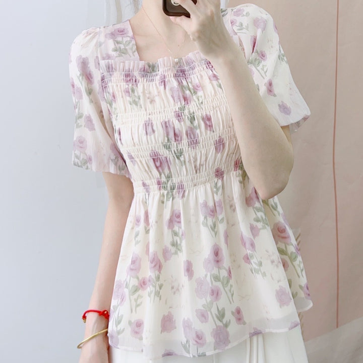 Damebluse med blomster smock-design og elastisk kant Stilla