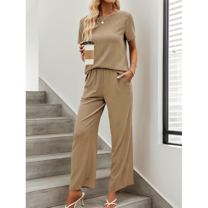 Dame kortærmet jumpsuit med flæse detaljer og bindebælte Skovae
