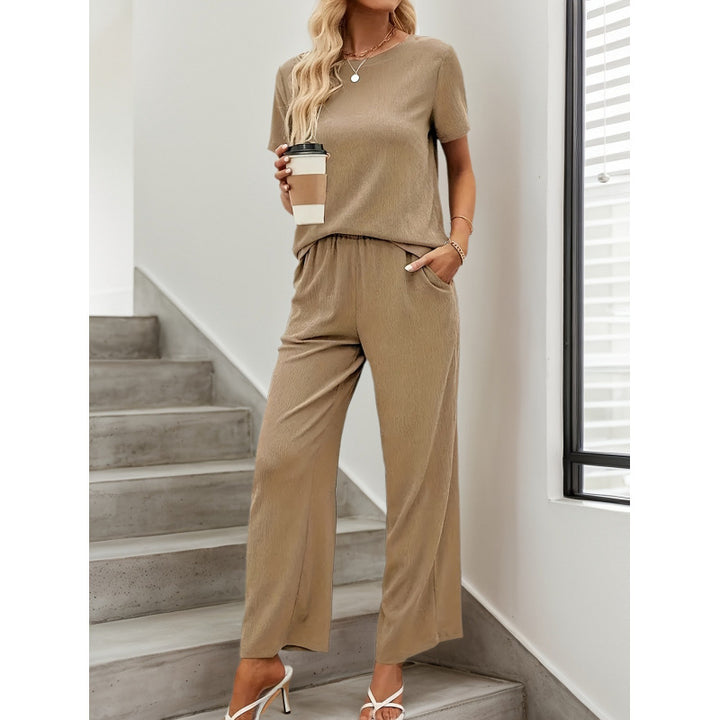 Dame kortærmet jumpsuit med flæse detaljer og bindebælte Skovae