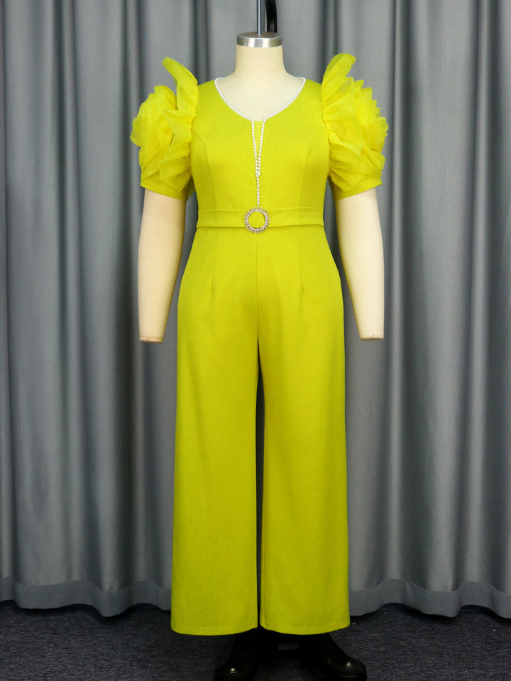 Dame elegant jumpsuit med voluminøse puffærmer og perleaccent Skovae