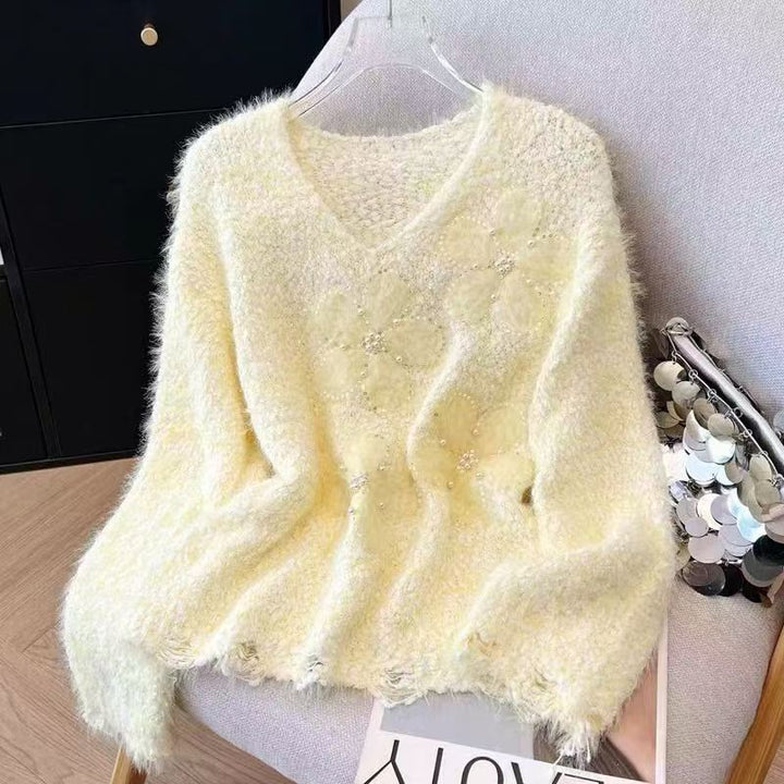 Kvindernes hyggelige sweater med blomsterapplikationer Stilla
