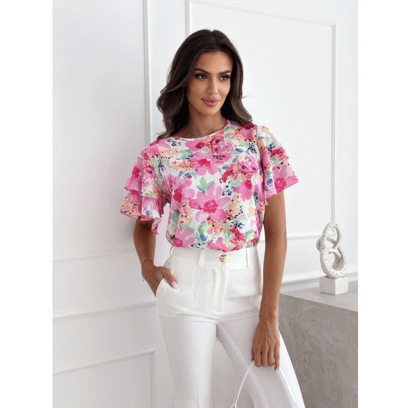 Damebluse med voluminøse flæseærmer og blomstermotiv Stilla
