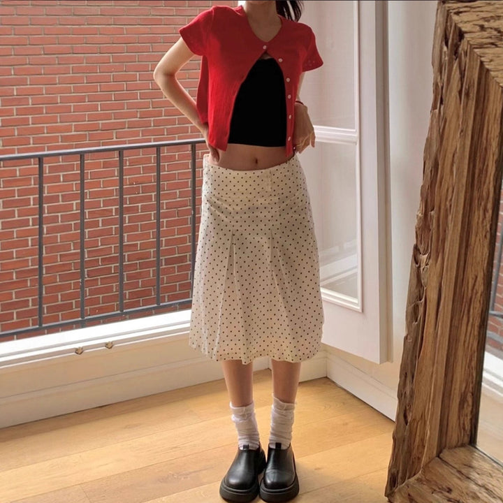 Dame midi skirt with playful polka dot pattern and elegant A-line Skovae
